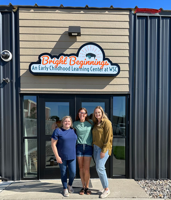 LaShan Mallett, preschool teacher, Janie Cox, owner, and Taylor Evenson, supervisor and curriculum director, stand in front of the new Bright Beginnings daycare center  located on the Williston State College campus. 
Contributed photo
