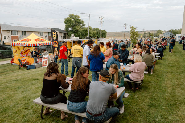 Concert goers enjoying the food trucks before the Hometown Healing concert. 
By Erica Kingston
